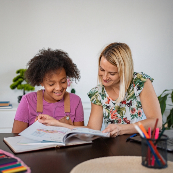 therapist helping child with school work